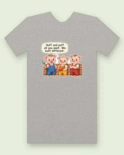 The Three Little Pigs tee mockup: three little pigs in overalls in front of a brick wall, saying “Huff and puff all you want. We built different.”